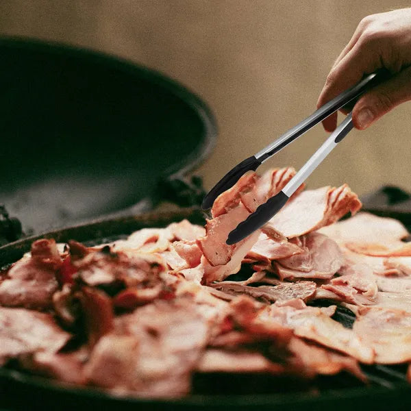 Silicone-tipped stainless steel kitchen tongs – non-stick food handling for grilling and cooking.