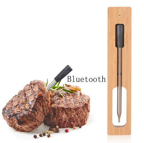 Wireless Bluetooth BBQ probe thermometer showing temperature on digital screen for outdoor grilling