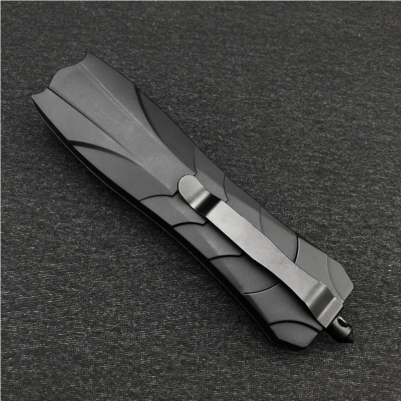 Ergonomic handle of portable camping and grilling knife for secure grip.