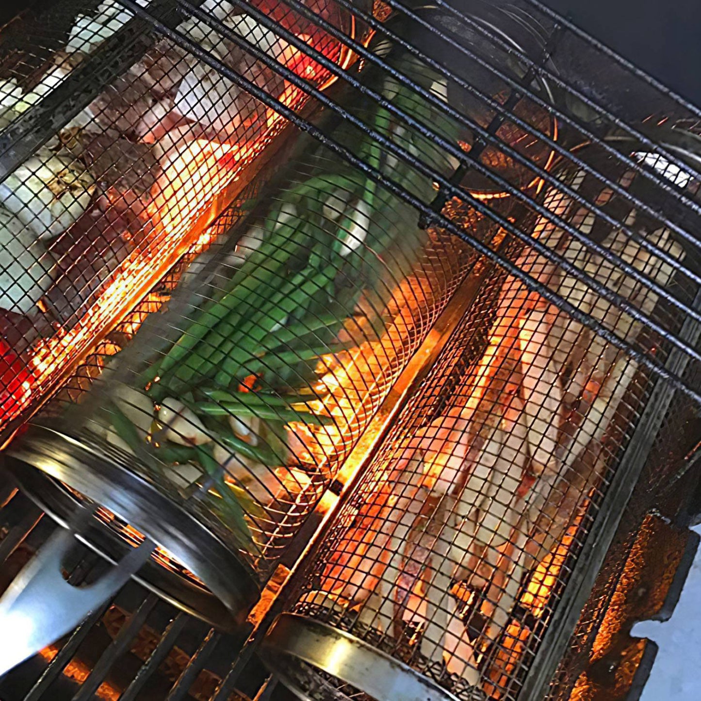 Close-up of a grill with food being cooked inside