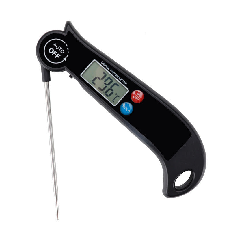 Digital cooking thermometer close-up showing electronic display and stainless steel probe.