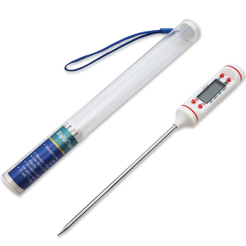 Digital meat thermometer showing internal temperature of cooked meat on cutting board